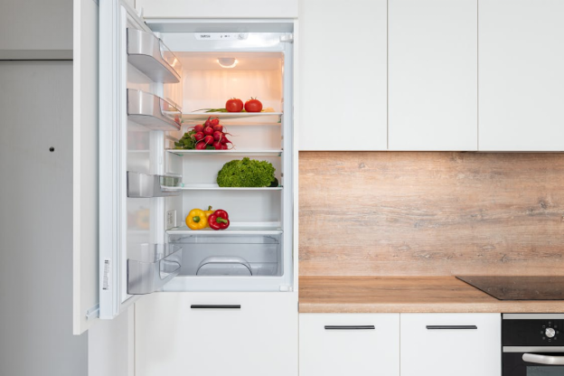 An open refrigerator with vegetables