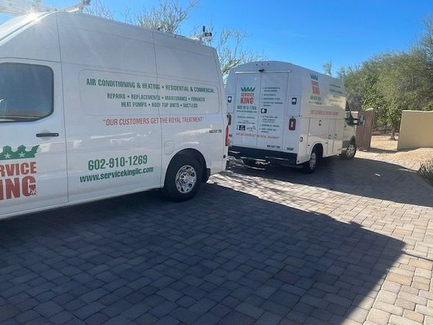 A large space with commercial vans.