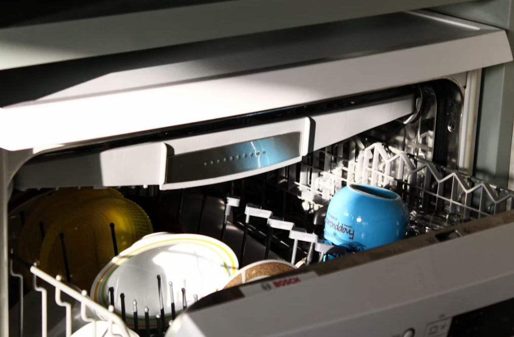 This image shows a dishwasher with dishes inside it.
